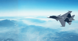 Military aircraft flying in sky