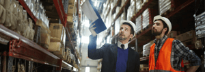 Two people inspecting in the warehouse
