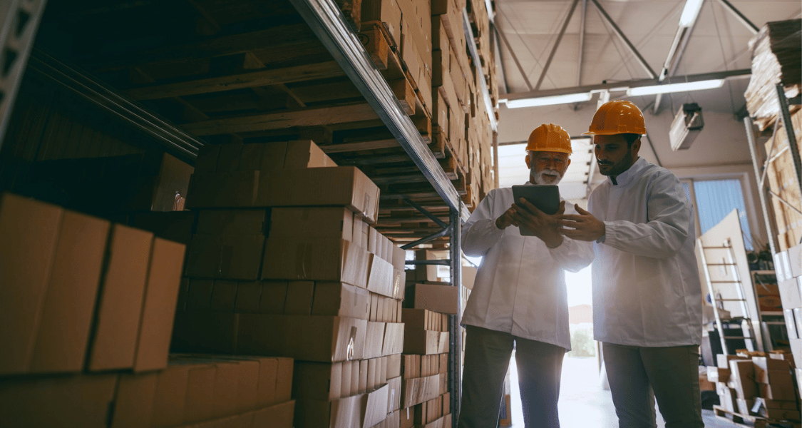Warehouse inspectors looking at checklist Warehouse inspectors looking at checklist