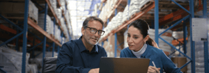 Workers on computer looking at resources